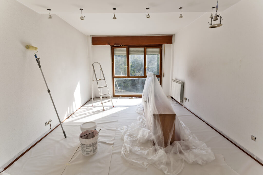 preparing room for painting with roller and ladder 2026 03 17 20 15 29 utc